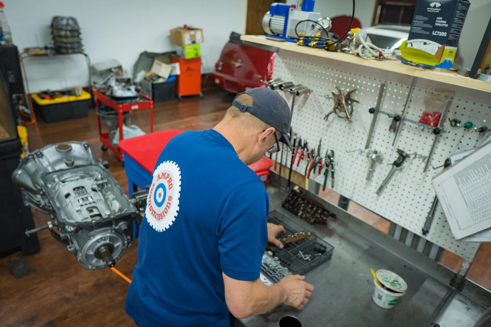 AMPro builder working on a transmission in the Wisconsin shop